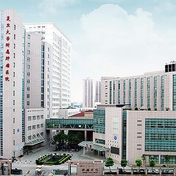 Xuhui campus of Fudan University Shanghai Cancer Center (复旦大学附属肿瘤医院) on Dong'an Road, with the hospital name on the main tower